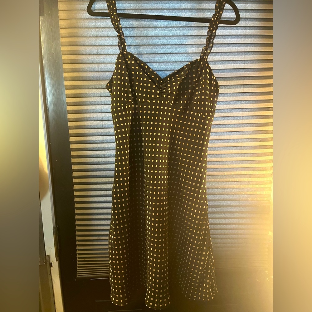 Urban outfitters polka-dot black mini dress, small ruffles, size medium.